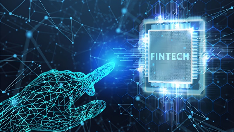 Hi-tech futuristic finger pointing at fintech microchip